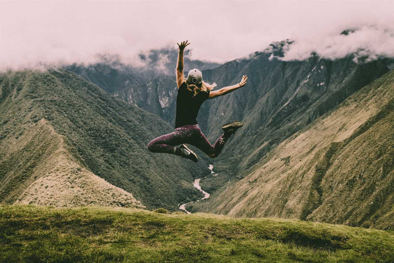 Woman leaping in mountain scene like raising influencer rates