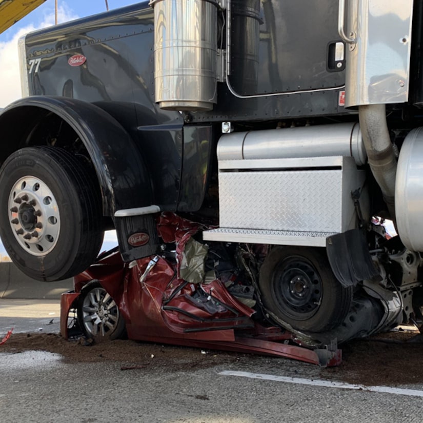 Woman Somehow Walks Away From Nissan Folded in Half and Completely Flattened by Semi Truck